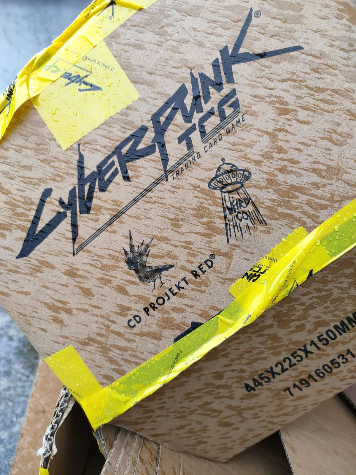 Cyberpunk TCG delivery box arriving in the Kent rain at Ravenspire Games